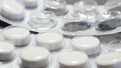 blisters with white pills, one full and the other almost empty