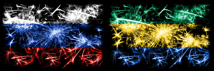 Russia, Russian vs Gabon, Gabonese New Year celebration sparkling fireworks flags concept background. Combination of two states flags