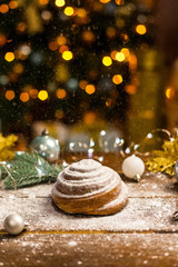 Homemade traditional winter festive Bun on wooden background.