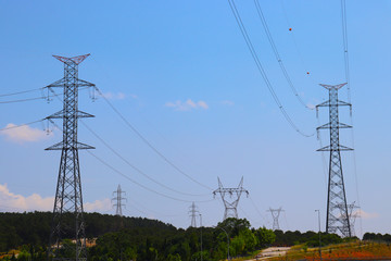 Fototapeta premium High-voltage power pylon under blue sky