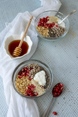Healthy breakfast mood, muesli with raw pomegranate, sunflower and sesame seeds.