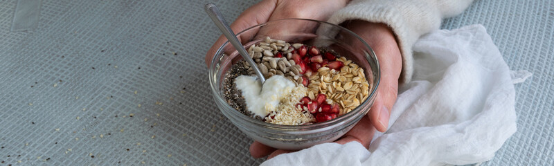 Healthy breakfast mood, muesli with raw pomegranate, sunflower and sesame seeds. Personal point of view