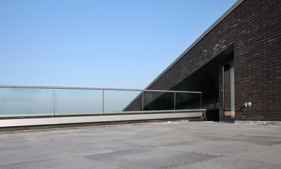 Fototapeta na wymiar Modern Dutch architecture. Glass panels. Banister. Balcony. Handrail.