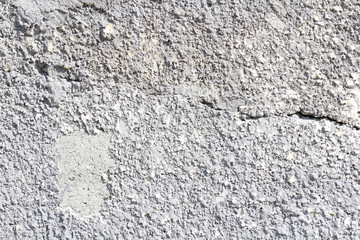 Concrete wall texture background. Natural stones. Building's facade decor. Decorative plaster. House exterior. 