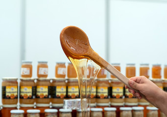 Fresh honey on a wooden spoon