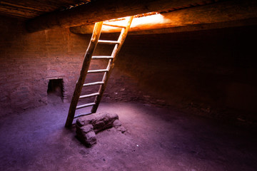 Ladder with light descending into Pueblo Kiva in New Mexico.