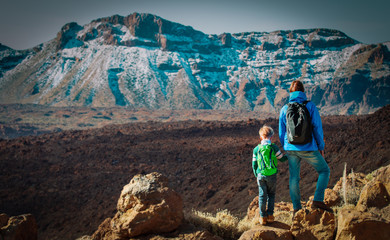 father and son hiking in scenic mountains