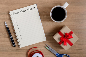 New Year's Goals List written on Notebook with gift box