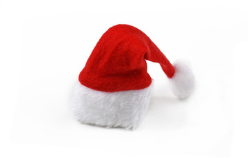 Obraz na płótnie Canvas Red santa hat with white pompon isolated on white background