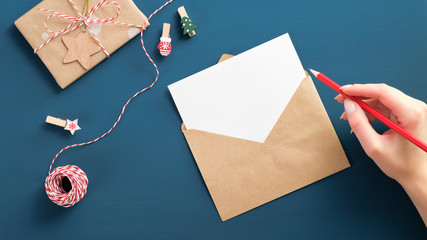 Hand writing letter to Santa Claus mockup. Flat lay blank paper card, craft envelope, vintage gift...