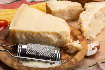 Cooking with hard italian cheese, grated parmesan or grana padano cheese