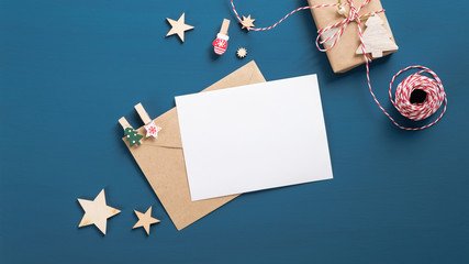 Letter to Santa Claus mockup. Flat lay blank paper card, craft envelope, gift box, wooden...