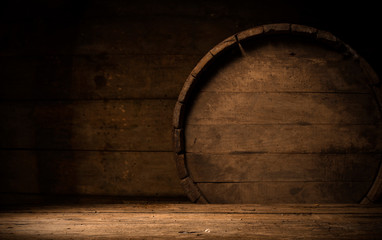 Old wooden barrel on a brown background