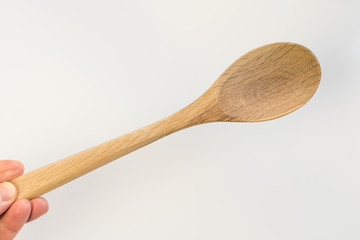 Traditional wooden spoon isolated on white background