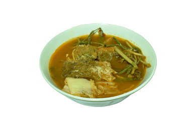fried fish and egg stuffed climbing wattle in spicy sour soup on bowl