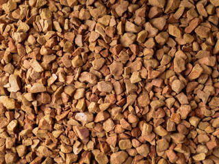 Ground coffee in granules. The texture of the freshly ground coffee granules
