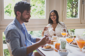 Couple in love eating breakfast in the morning