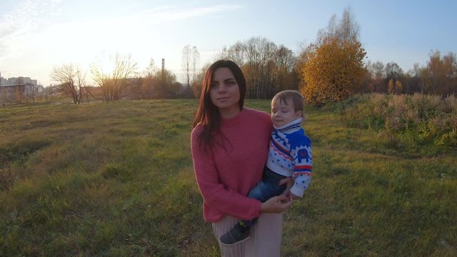 Infant boy in mom's arms