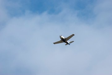 Screw plane against the blue sky. Flying lessons in dreams and in reality. Piloting small aircraft.
