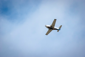 Fototapeta na wymiar Screw plane against the blue sky. Flying lessons in dreams and in reality. Piloting small aircraft.