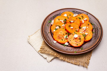 Roasted pumpkin with salted cheese and herbs