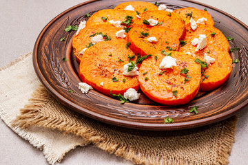 Roasted pumpkin with salted cheese and herbs
