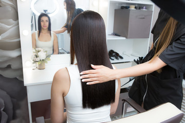 Saturated healthy shiny hair after keratin recovery. The concept of recovery structure.