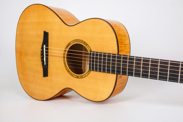 wood texture of lower deck of six strings acoustic guitar on white background. guitar shape