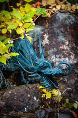 A dragon head fountain in a Japanese temple