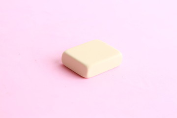 white eraser on color background