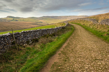 Fototapeta na wymiar Scar End is a settlement on the side of Twistleton Scar in the English county of North Yorkshire. It is surrounded by Ingleborough and Whernside 2 of the 3peaks.