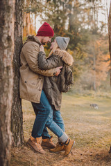 Hiking couple with backpack walking in the forest and exploring outdoors. Freedom and active travel concept.