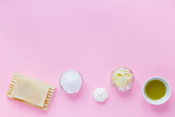 spa set products for self-care at home on pink background. flat lay