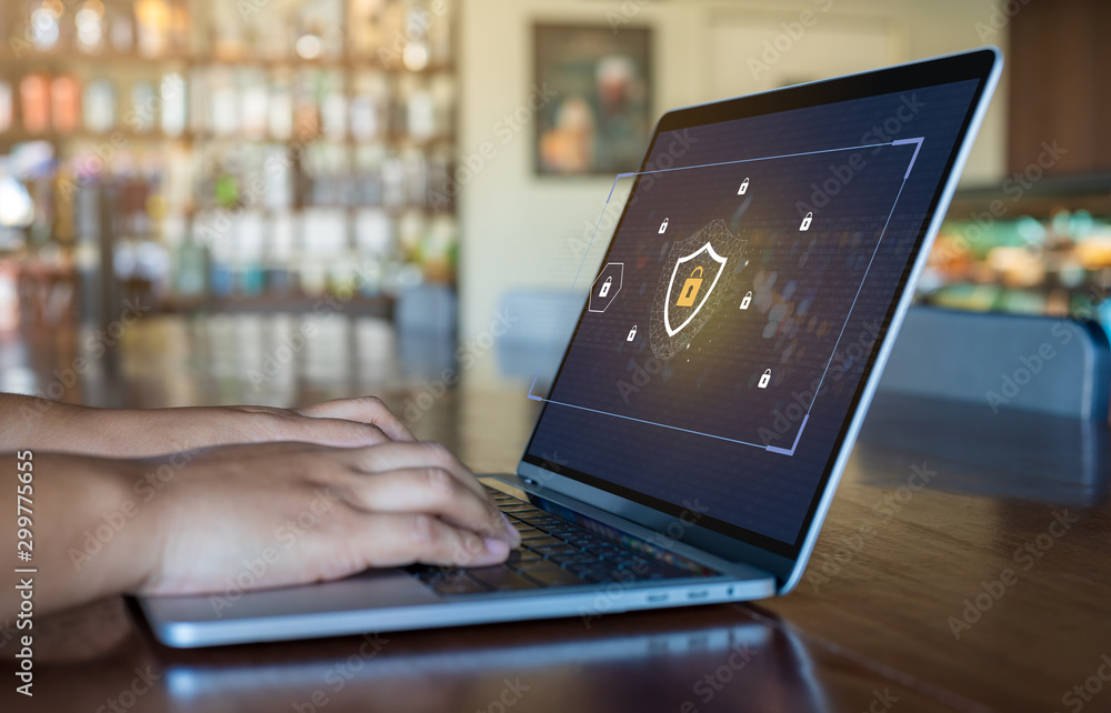Poster person using a laptop computer with data protection, cyber security, information safety and encrypti