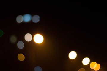 Abstract image of bokeh lights in the city. With strong yellow light