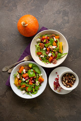 Healthy salad with pumpkins and blue cheese