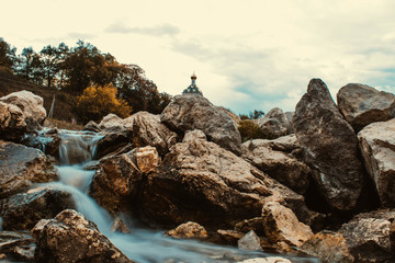 waterfall on the background of the Church