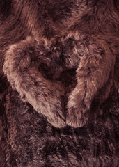 Rabbit fur jacket in heart shape photographed as a background
