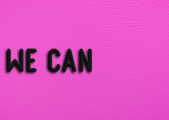 “We can” on pink leather background