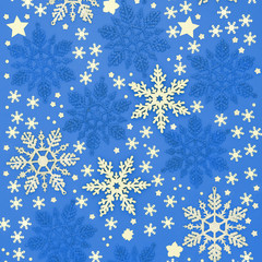 Christmas snowflake and star decorations on blue background. Traditional greetings card or wrapping paper design for the festive season.