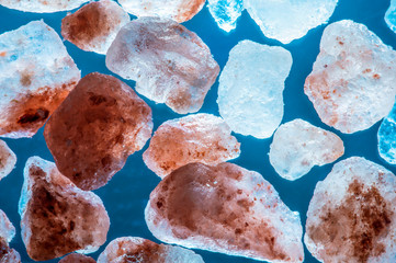 collection of minerals on blue background, himalayan salt rocks