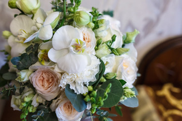 bright wedding bouquet of summer white pink roses  with wedding rings