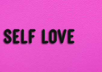 “Self love” on pink leather background