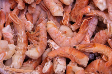 Seafood ingredients for best medditerrainean cuisine. Shrimp tails in pile close-up.