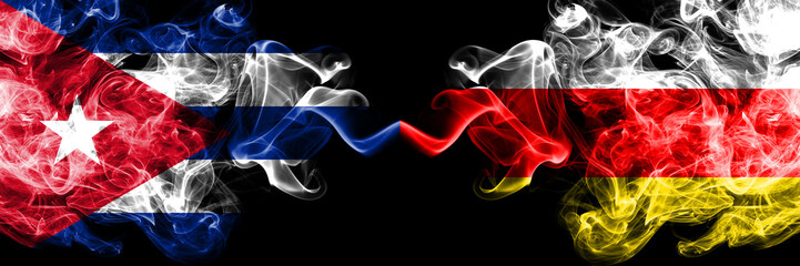 Cuba, Cuban vs South Ossetia smoky mystic flags placed side by side. Thick colored silky travel abstract smokes banners.