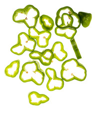 Slices of very fresh green pepper (with drops of water) falling. Isolated on white background.