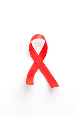 The red ribbon is an international symbol of HIV and AIDS awareness