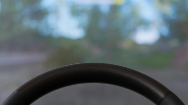 driving with a steering wheel in a racing game on a game console