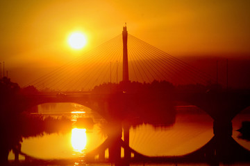 Obraz premium Suspension bridge in sunset France