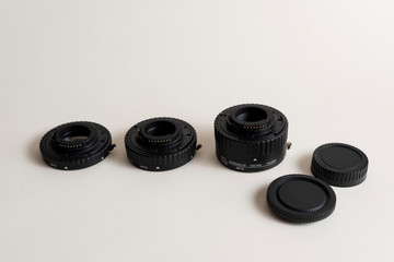 Extension rings for macro photography. Automatic tube set as macro lens alternative isolated.White background macro ring isolated background professional photographer equipment macro photography .